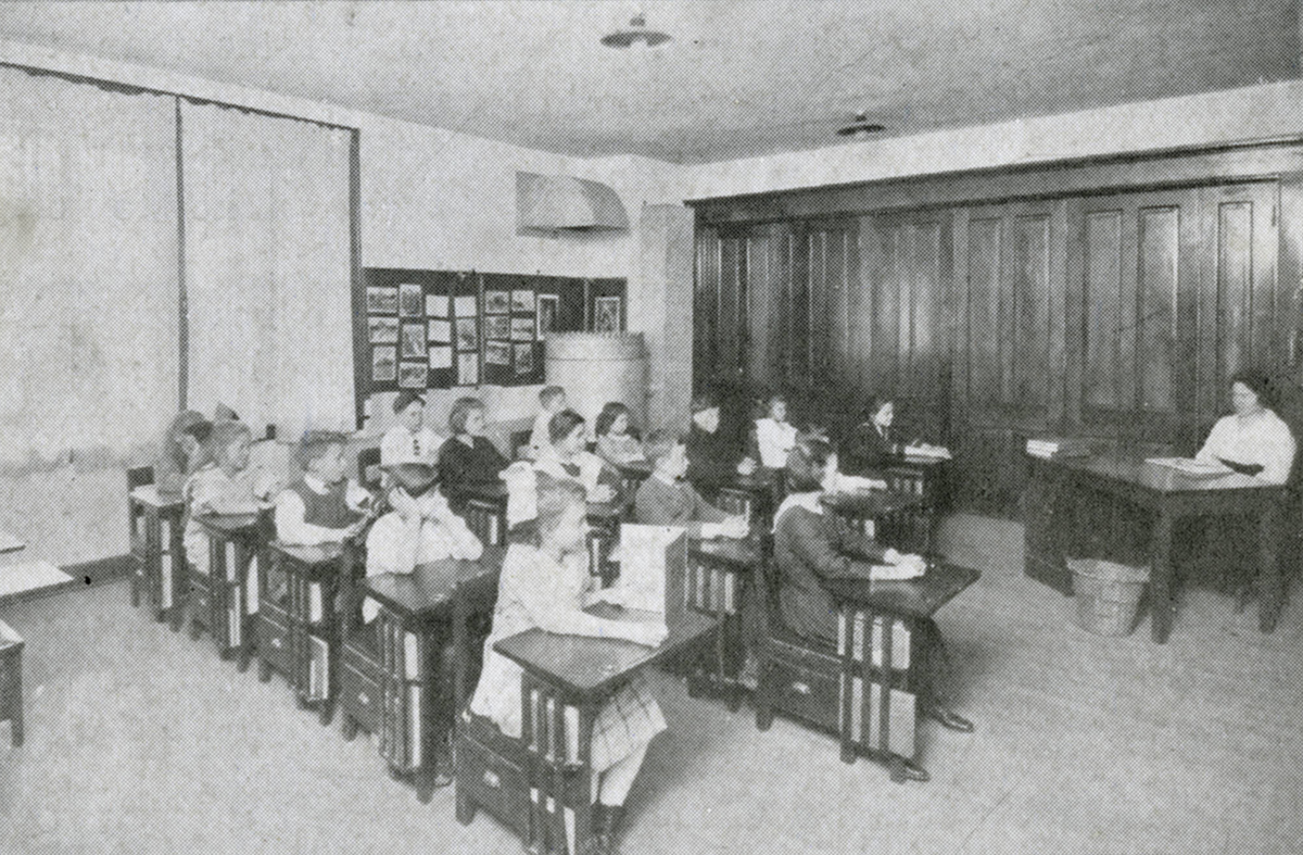 Students seated in a classroom at the barracks school in 1919